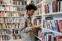 Teen reading a book [Photo: Cottonbro Studio]