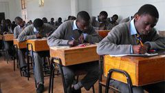 Students writing their KCSE