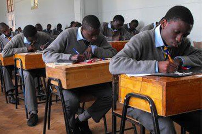 Students writing their KCSE