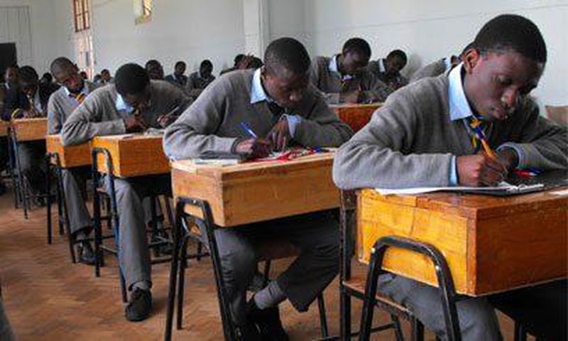 Students writing their KCSE