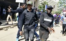 An undercover police officer arrests an activist within the Nairobi's Central Business District (CBD) during a demonstration against the Financial Bill 2024.