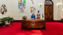 US First Lady Jill Biden signs the visitors book at State House, Nairobi on February 24, 2023