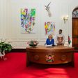 US First Lady Jill Biden signs the visitors book at State House, Nairobi on February 24, 2023