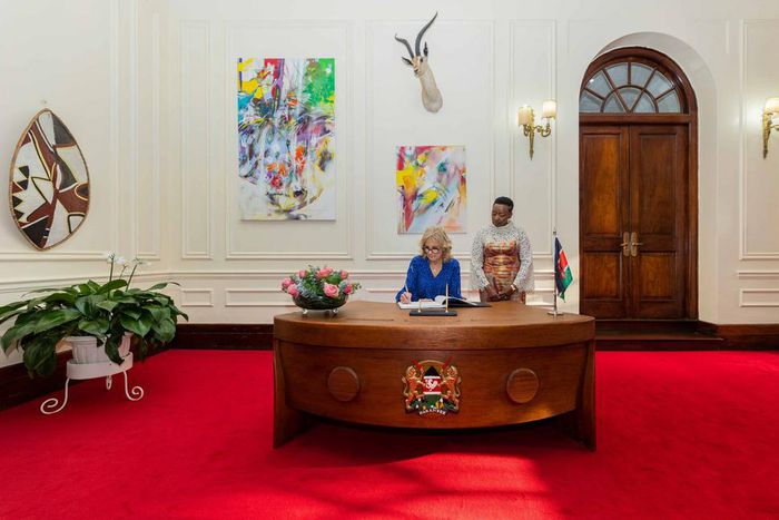 US First Lady Jill Biden signs the visitors book at State House, Nairobi on February 24, 2023