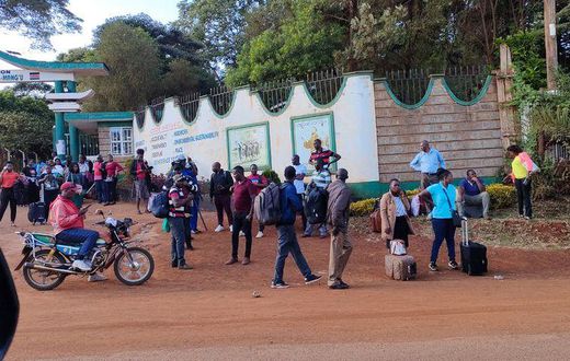 Examiners leave St Francis Girls Mangu High School after the examination centre was closed following a strike