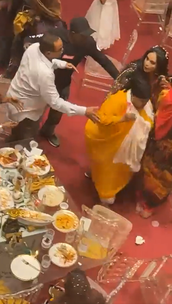 Injured woman escorted out of a wedding reception venue in Mombasa after a fight broke out