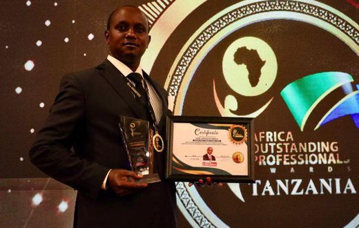 Makueni County Assembly Speaker Douglas Mbilu with his award in Tanzania