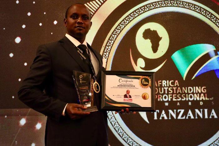 Makueni County Assembly Speaker Douglas Mbilu with his award in Tanzania