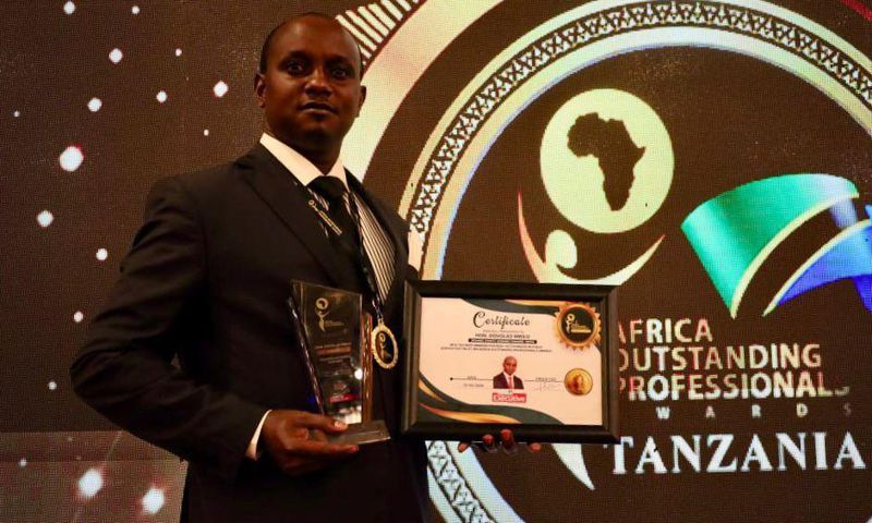 Makueni County Assembly Speaker Douglas Mbilu with his award in Tanzania