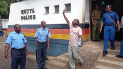 Good News International Church leader Paul Mackenzie Nthenge being led out of a police station