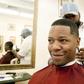 A man getting a haircut in a barbershop