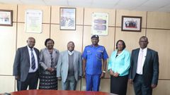 NPSC Chairperson, Eliud Kinuthia, CBS, (3rd left) flanked by NPSC Commissioners and Ag. CEO/CS welcoming Douglas Kanja in blue Police Uniform at NPSC Headquarters.