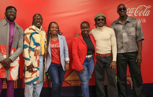 Polycarp, Chimano, Savara and Bien from Sauti Sol pose for a photo with Isabelle Rostom Kariuki, Coca Cola's Marketing Director, East and Central Africa at the Sol Fest partnership announcement between Coke Studio and Sauti Sol, earlier today at the Co...