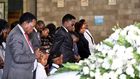 Sports CS Ababu Namwamba and his family at Consolata Shrine during the requiem mass of Prisca Mwaro