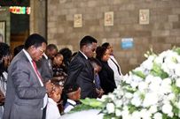 Sports CS Ababu Namwamba and his family at Consolata Shrine during the requiem mass of Prisca Mwaro