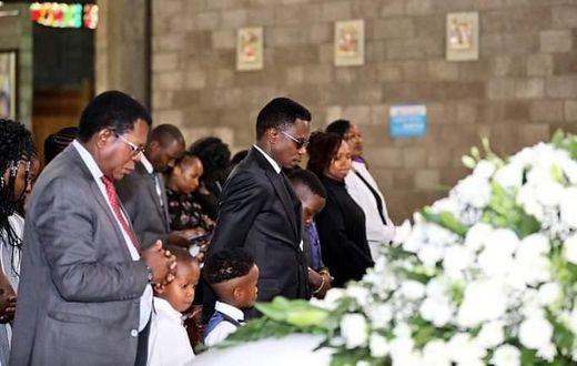 Sports CS Ababu Namwamba and his family at Consolata Shrine during the requiem mass of Prisca Mwaro