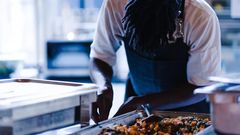 A chef cooking photo credits - Okay Africa