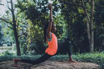 A woman showcasing a yoga pose outdoors [Photo: Oluremi Adebayo]