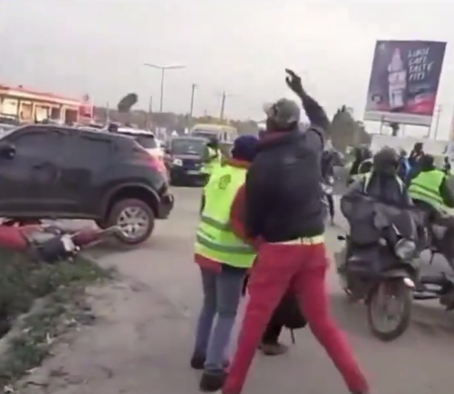 Boda boda riders and pedestrians at the scene in Kitengela where the car was stoned on Thursday