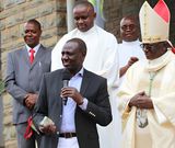 President William Ruto presenting a donation to Embu Catholic Bishop Paul Kariuki during a past service