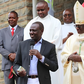 President William Ruto presenting a donation to Embu Catholic Bishop Paul Kariuki during a past service