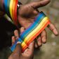 Man showing LGBTQIA ribbon on hand [Photo: Anete Lusina]