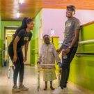 Daddy Owen engages with a physically challenged kid