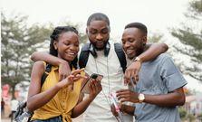 Kenyans enjoying content of a mobile phone