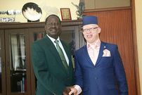 Azimio leader Raila Odinga and Isaac Mwaura