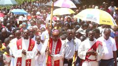 Nyeri Catholic Archbishop Antony Muheria carries a cross as led other faithful in a religious procession to Our Lady of Constanta Cathedral in Nyeri during a past event
