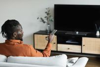 A man watching TV