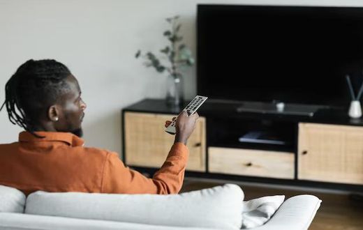 A man watching TV