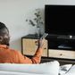 A man watching TV