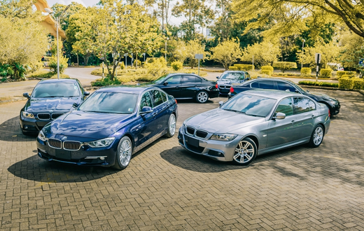 A photo of luxury vehicles in a parking lot