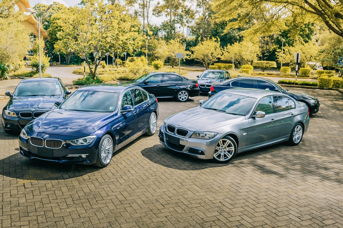A photo of luxury vehicles in a parking lot
