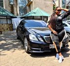 Kiss FM presenter Kamene Goro poses in front of her black Mercedes Benz