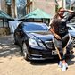 Kiss FM presenter Kamene Goro poses in front of her black Mercedes Benz