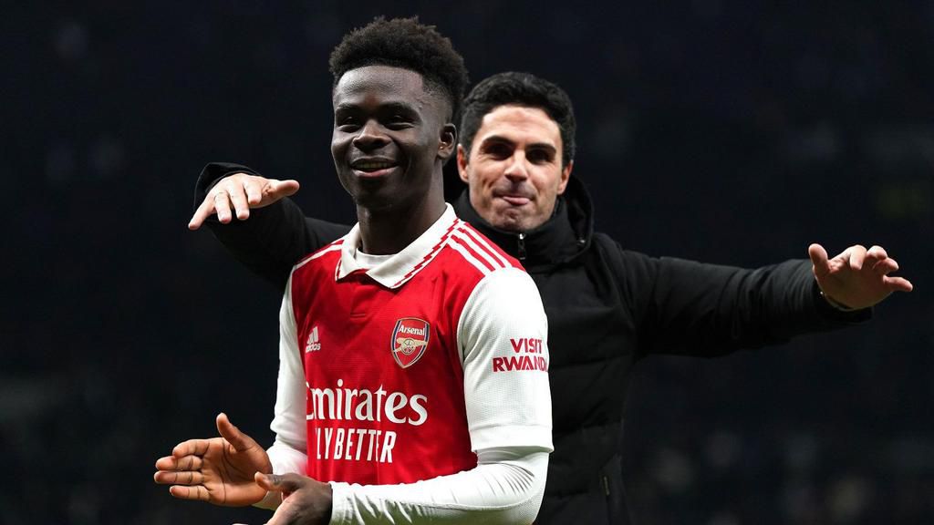 Arsenal manager Mikel Arteta celebrates with goalscorer, Bukayo Saka