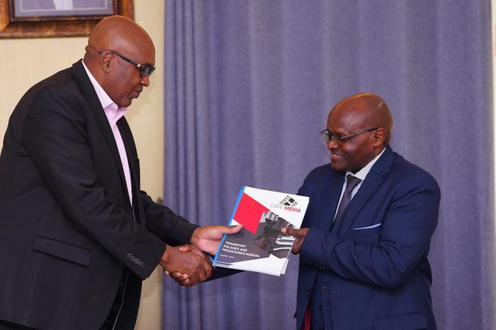 Prof Simon Gicharu as he welcomes Mwenda Njoka as Cape Media MD