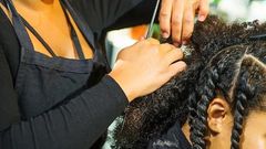 A woman being braided