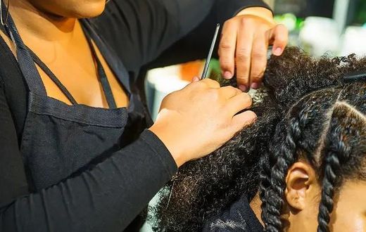 A woman being braided