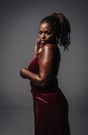 Woman with braided hair wearing an elegant dress [Image Credit: Jaycees]