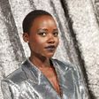 Oscar winner Lupita Nyong'o posed against the silver backdrop in a sequinned silver blazer dress.