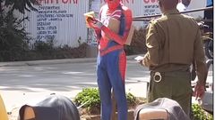 Police officer approaching 'Spider Man'