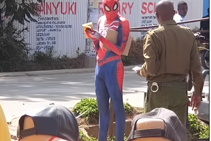 Police officer approaching 'Spider Man'