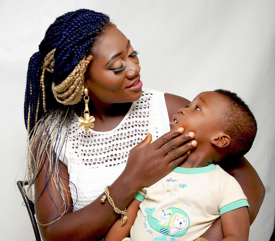 A lady playing with a kid