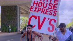 Eric Omondi pulling a hand cart