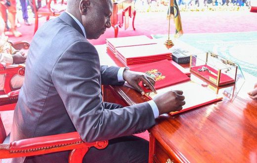 President William Ruto signs his oath of office during his swearing in ceremony in 2022