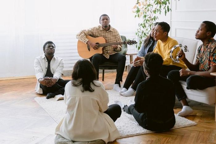 A group of people praying together [Image Credit: Tima Miroshnichenko]