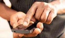 A person using M-pesa